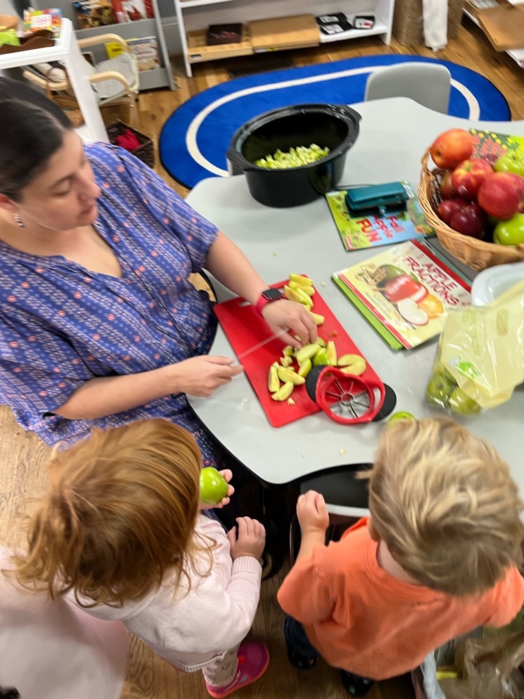 washing and cutting the apples for their cake